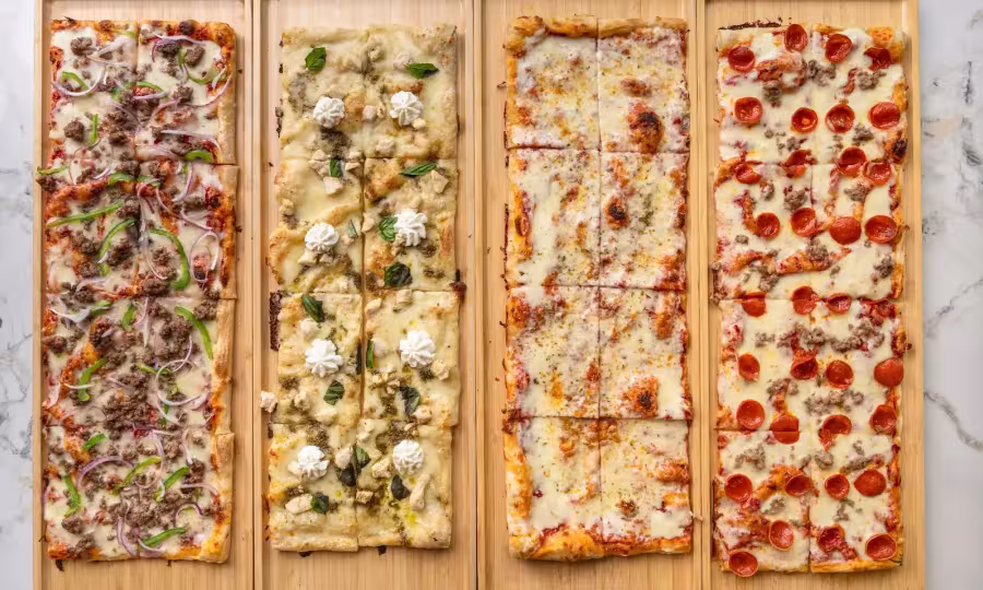 Trays of different Roman pizza options